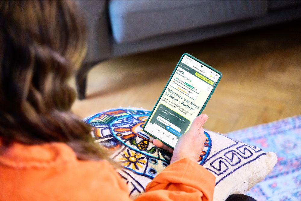 A customer using Porta on her phone to arrange a move